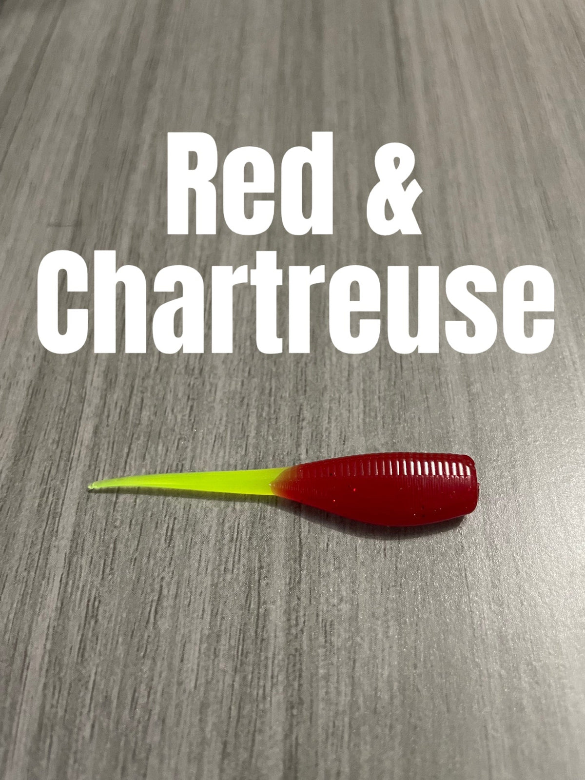Red and Chartreuse Shad Body crappie bait featuring a translucent red glittered ribbed body and a slim chartreuse tail.