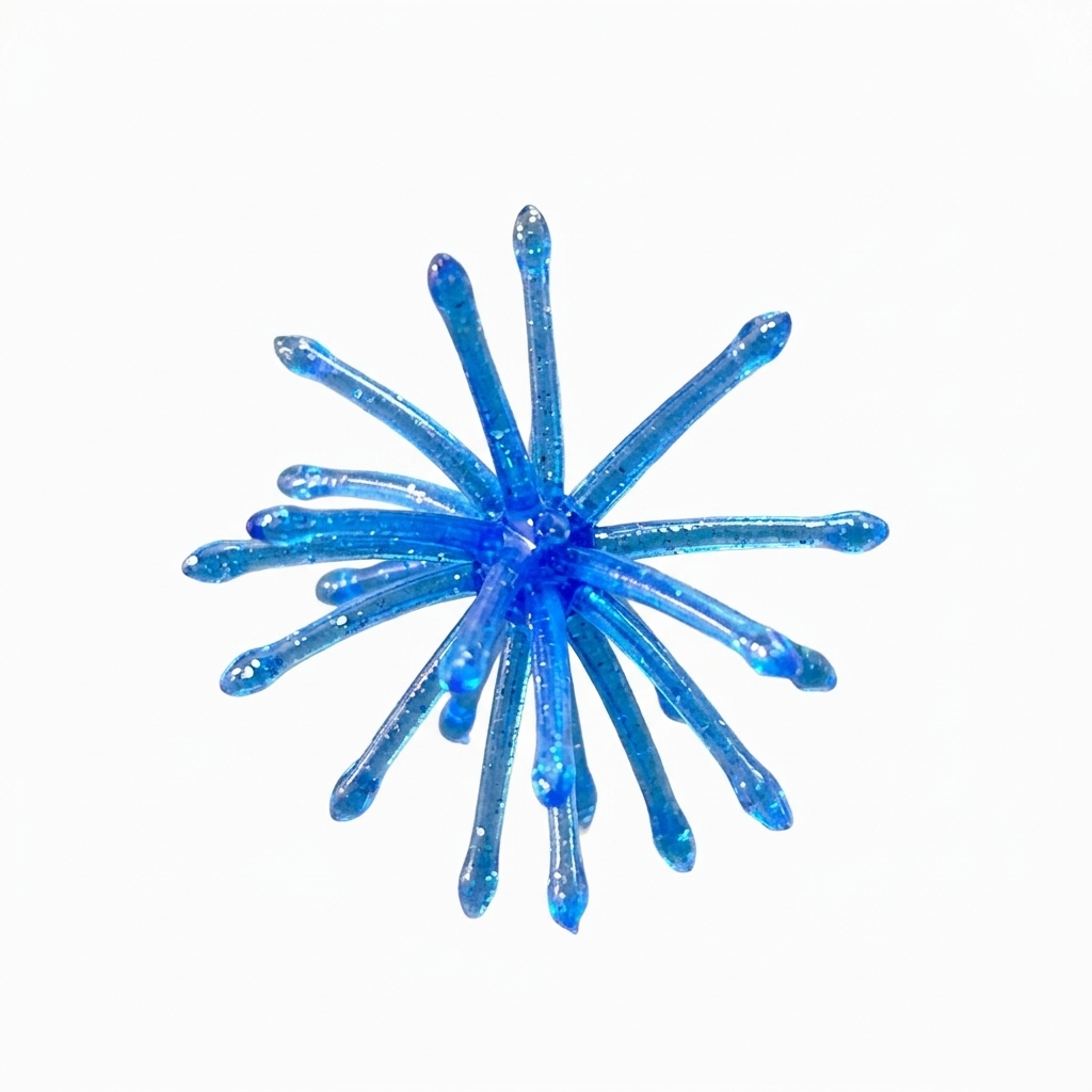 Blue and silver flake Urchin crappie bait with a solid center and flexible tentacles.