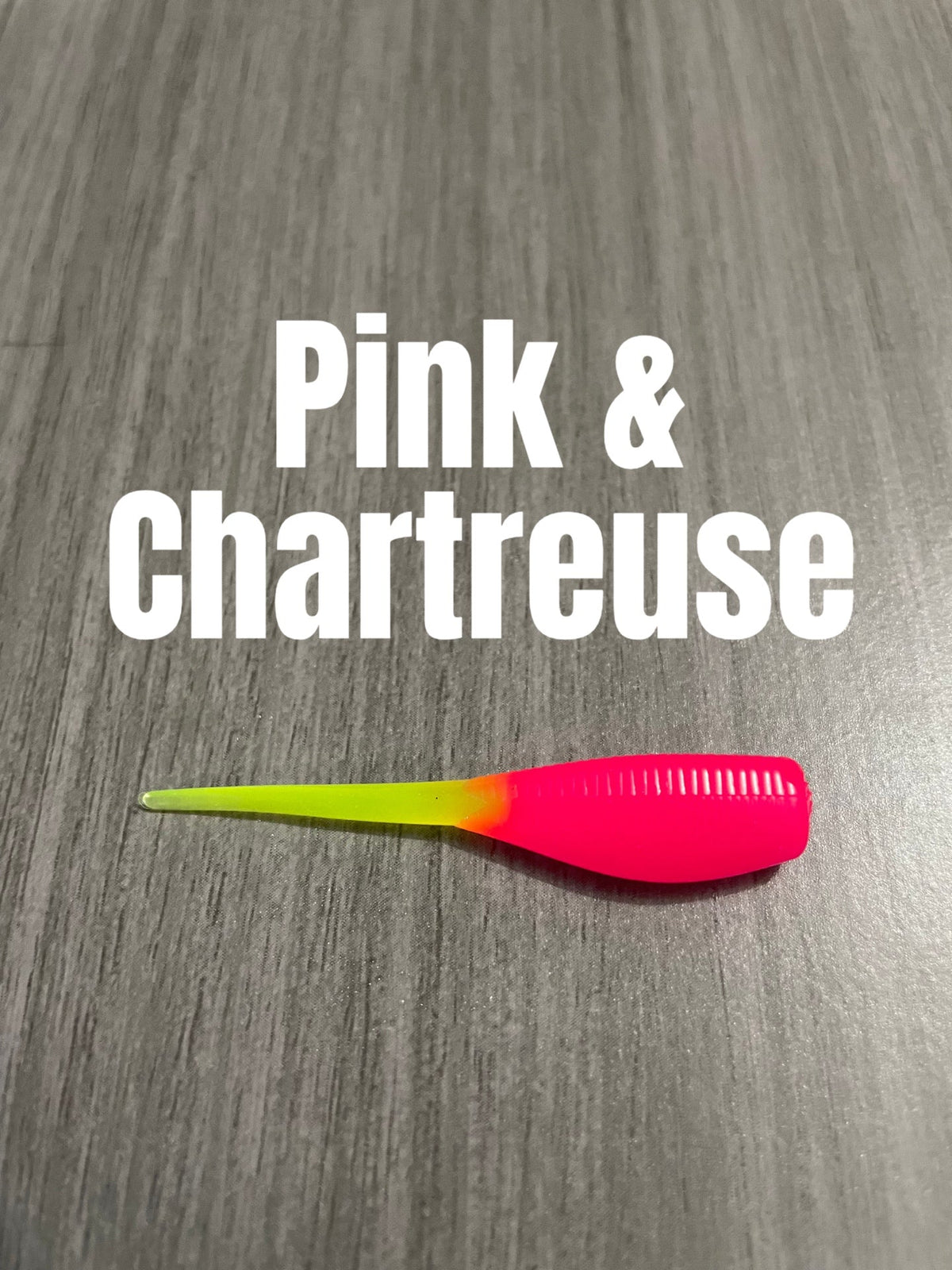 Shad Body crappie bait featuring a bright pink ribbed body and chartreuse tail, 15-pack.