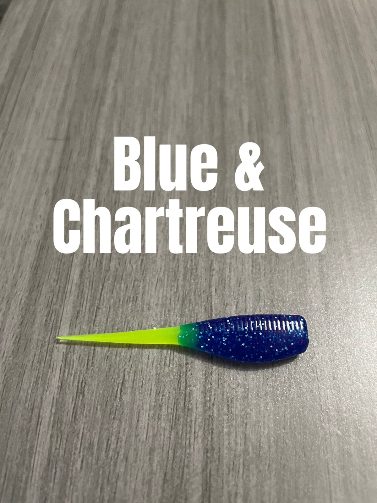 Livin' the Dream Crappie Baits Shad Body in Blue & Chartreuse with a dark blue-silver glittered body and chartreuse tail.