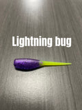 Lightning Bug Shad Body crappie bait with purple glittered ribbed body and bright chartreuse tail.