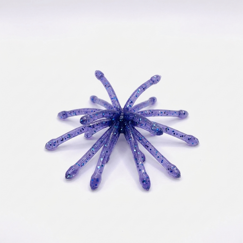 The Urchin crappie bait in Junebug, featuring a deep translucent purple body with black and iridescent flakes.