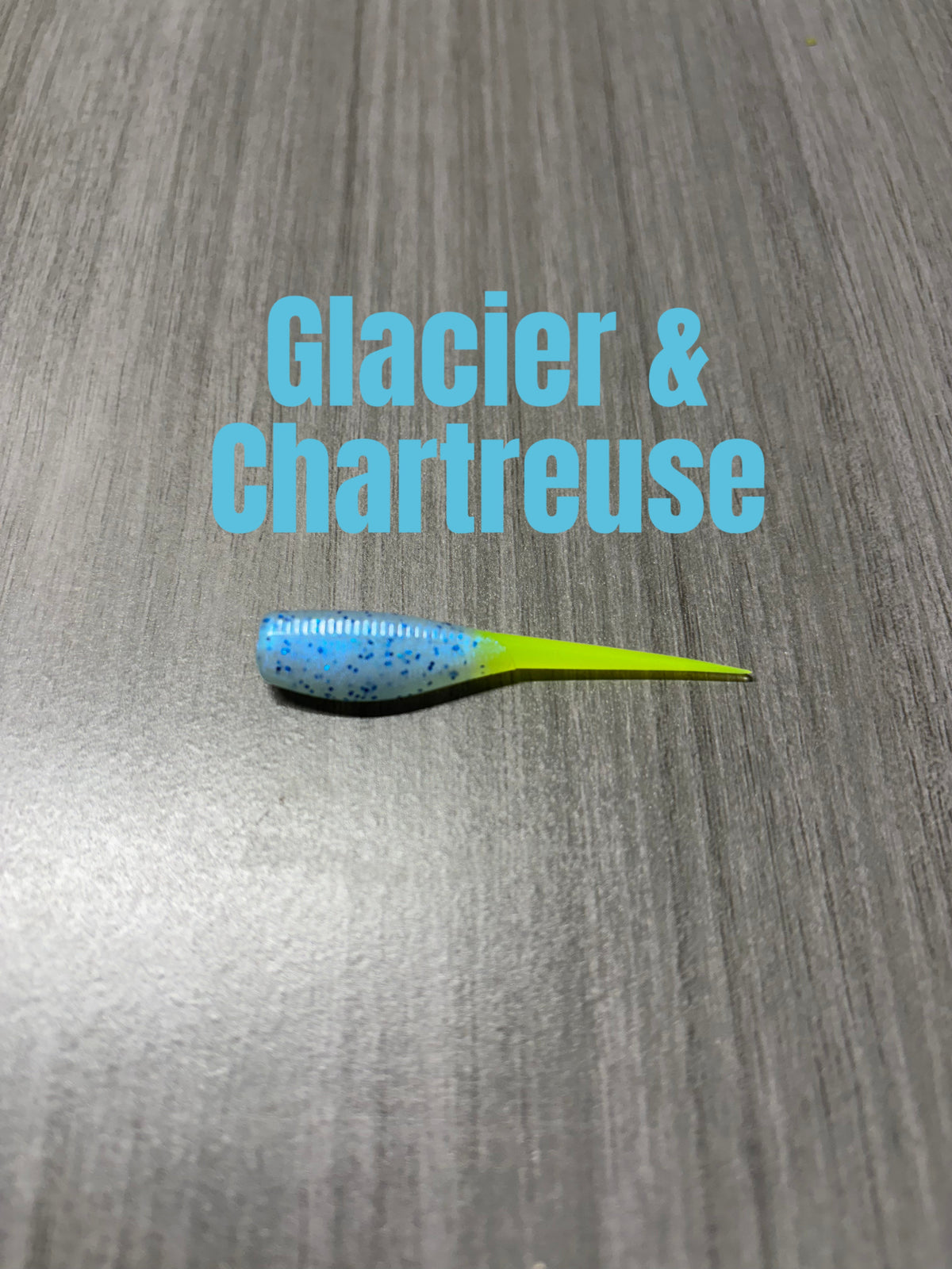Shad Body crappie bait in Glacier and Chartreuse with an icy light-blue body, dark blue glitter, and a chartreuse tail.